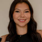 Esthetics graduate smiling at Debutantes School of Beauty in DeKalb Illinois.