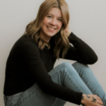 Cosmetology graduate smiling after completing training at Debutantes School of Beauty in DeKalb Illinois.