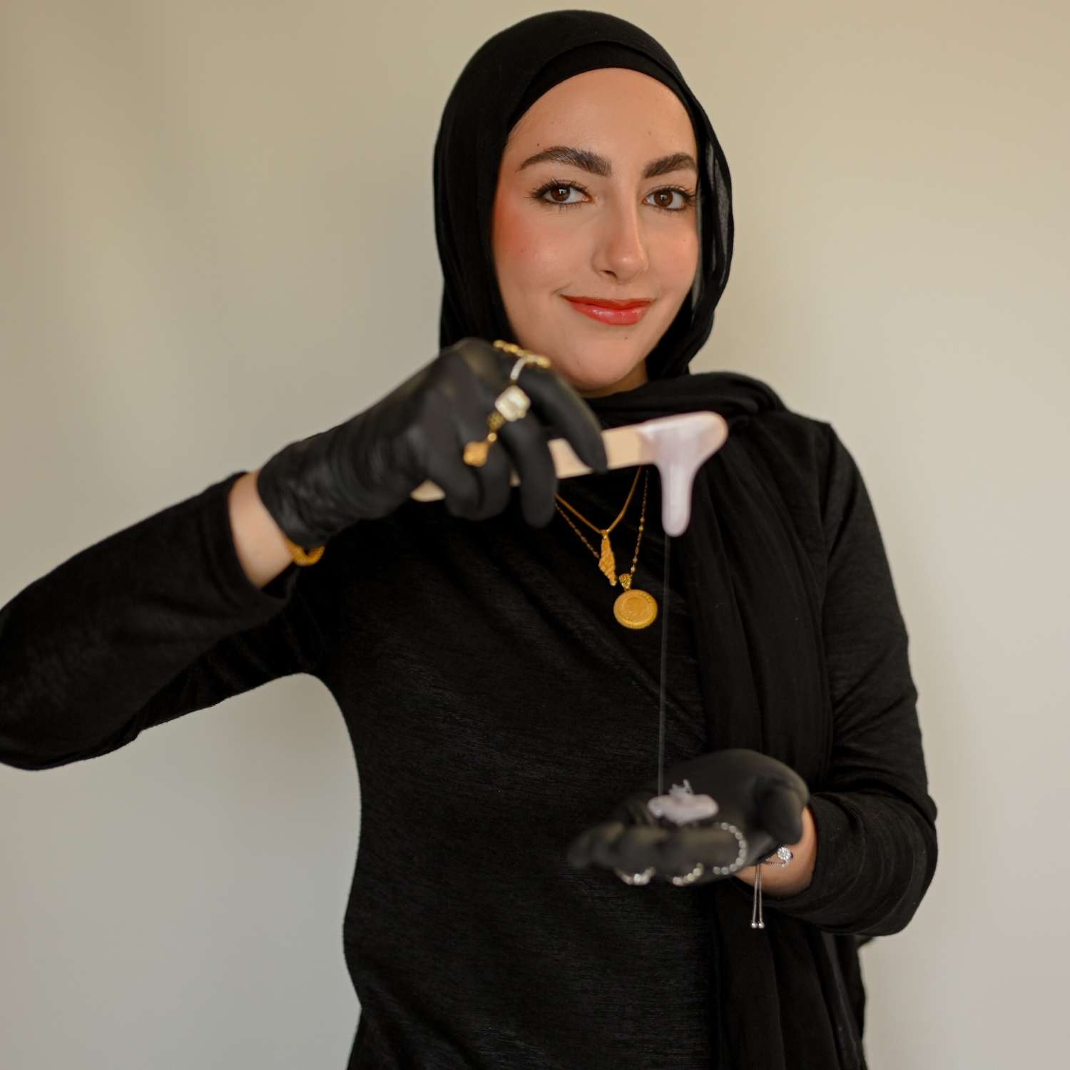 Esthetics student holding skincare tool during professional branding photoshoot.