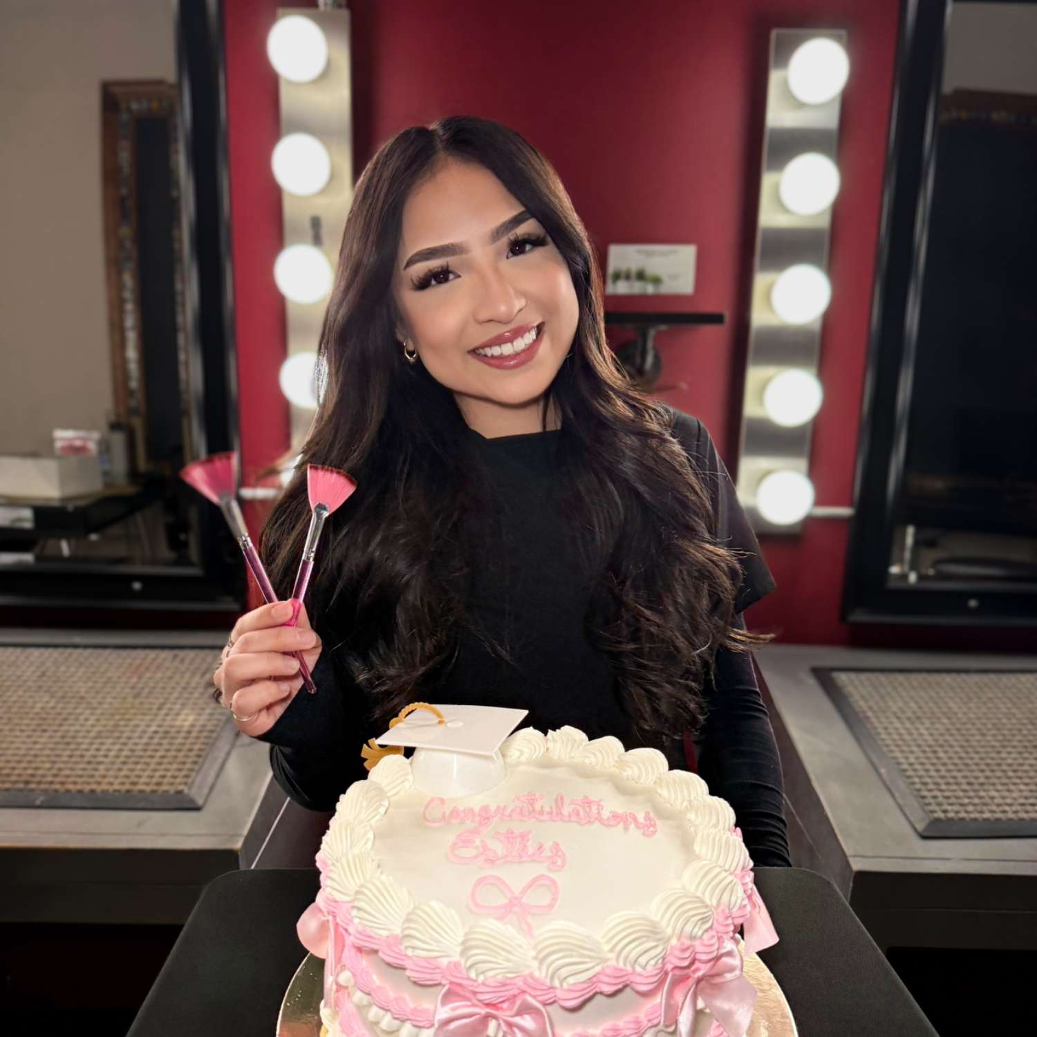 Esthetics program graduate celebrating completion of training at Debutantes School of Beauty in DeKalb Illinois.