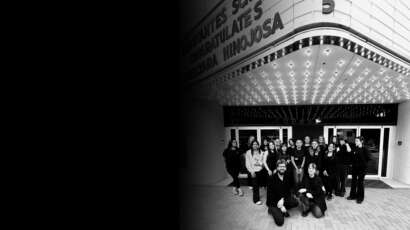 Students standing outside Debutantes School of Beauty in downtown DeKalb Illinois.