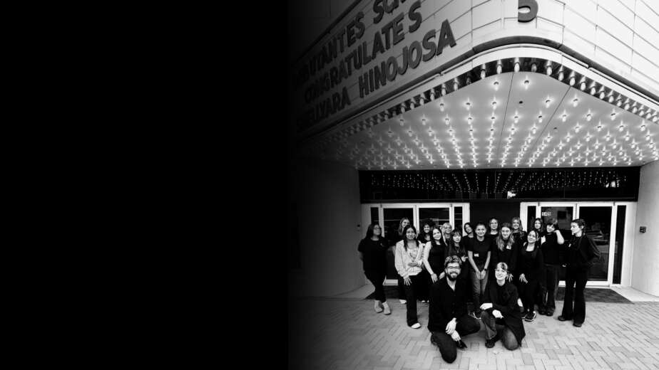 Students standing outside Debutantes School of Beauty in downtown DeKalb Illinois.