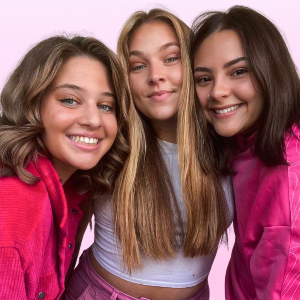 Students smiling together at Debutantes School of Beauty in DeKalb Illinois.